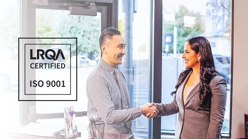 2 business peoples shaking hands and a logo for the ISO 9001 certification on the left